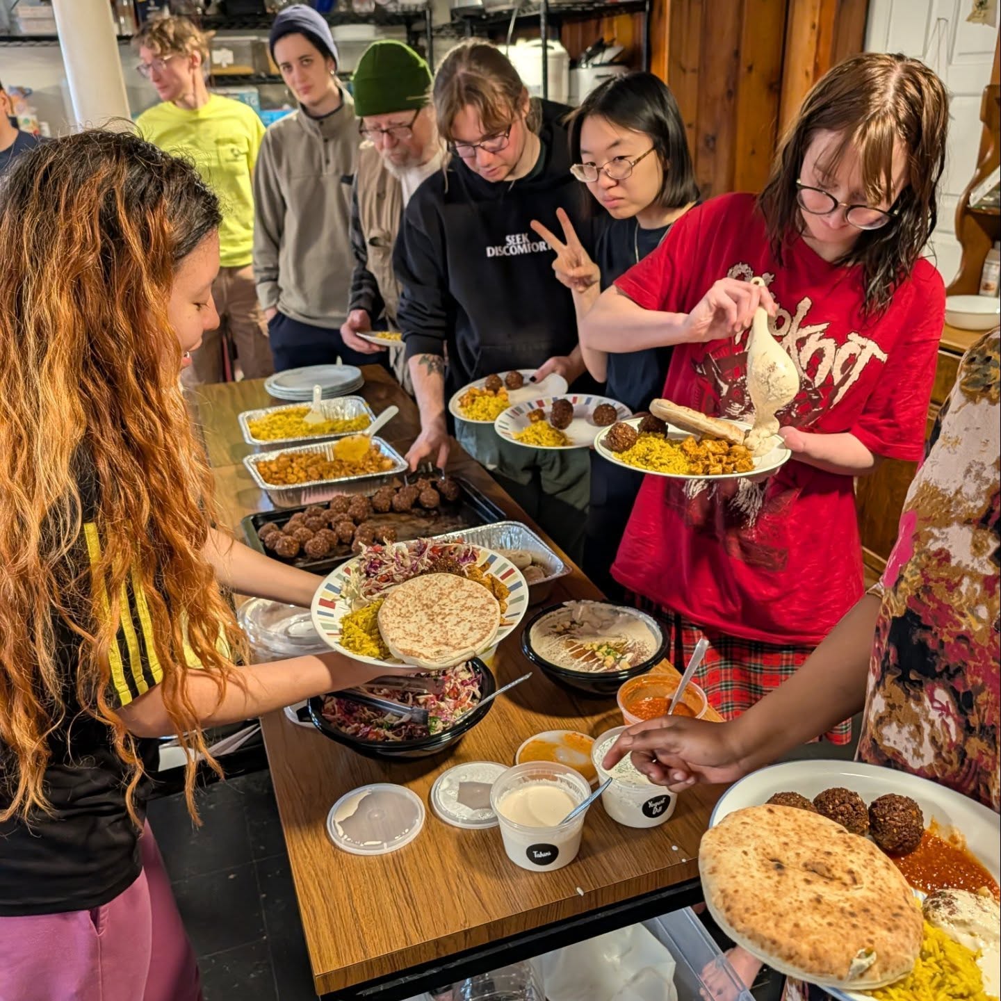 Nine Summiteers make their breakfast plates before work weekend (Fall 2025)