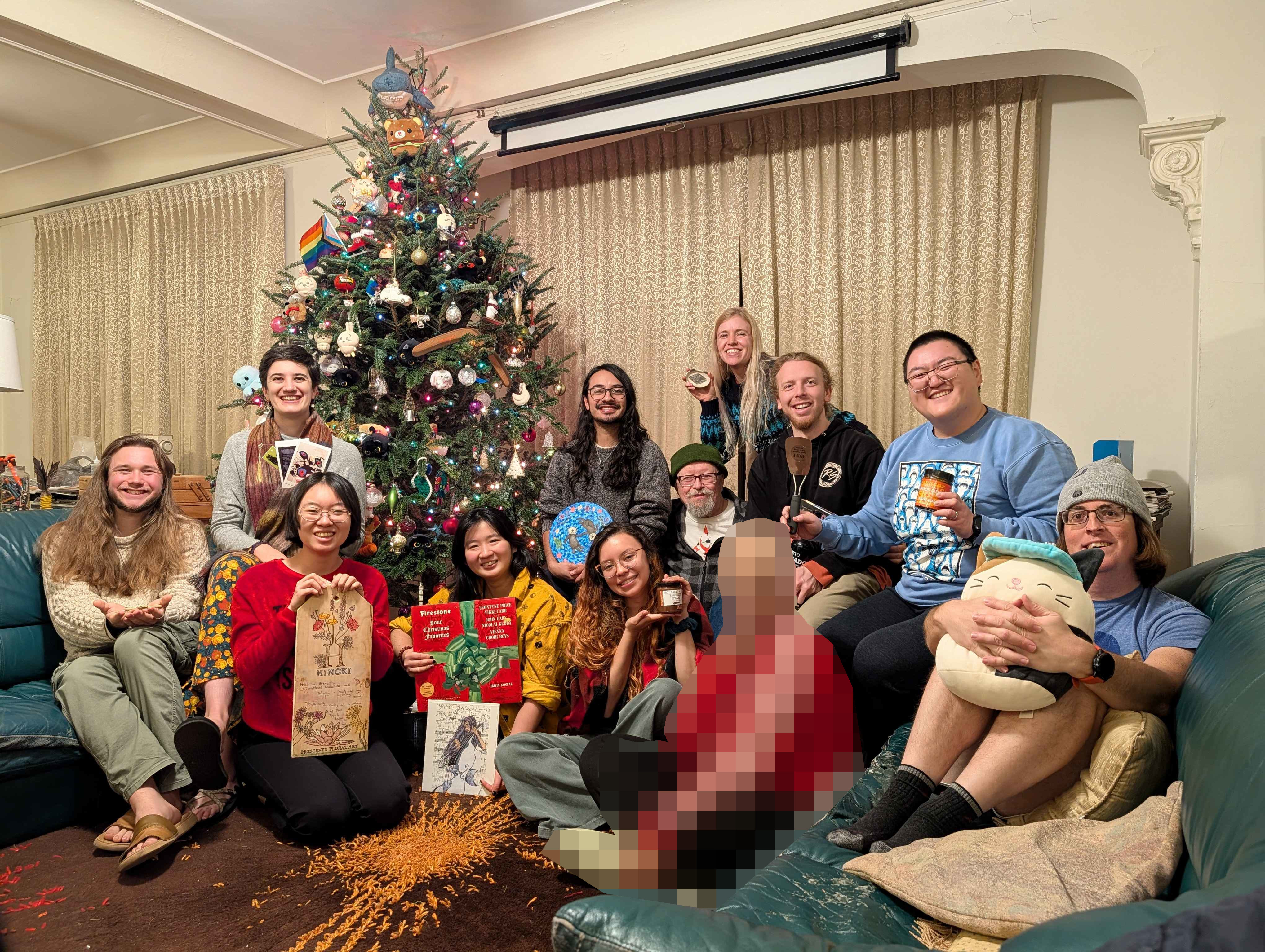 Summiteers sit in the living with their gifts. (December 2025)